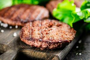 Fragrant grilled burger with greens. photo