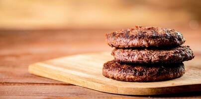 Burger grill on a cutting board. photo