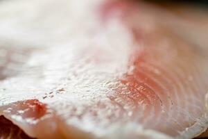 Raw fish fillet. Macro background. Texture of fish fillet. photo