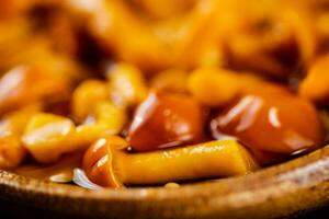 Fragrant marinated mushrooms. Macro background. photo