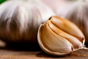 Cloves of fresh garlic on the table. photo