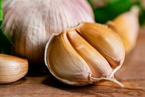 Cloves of fresh garlic with parsley. photo