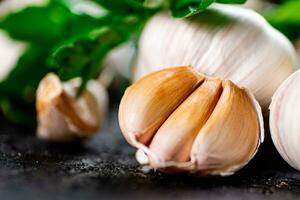 Fragrant garlic with parsley on the table. photo