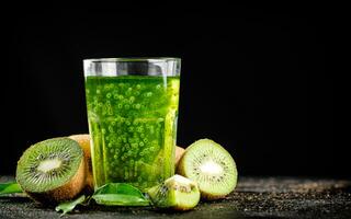 A glass of fresh kiwi juice. photo