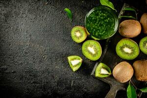 A glass of fresh kiwi juice. photo