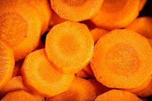 Sliced fresh carrots. Macro background. photo