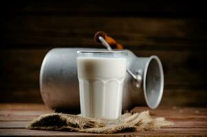 A glass of homemade village milk. photo