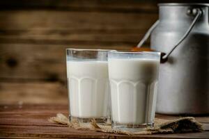 A glass of homemade village milk. photo