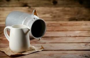 A jug of fresh milk on the table. photo