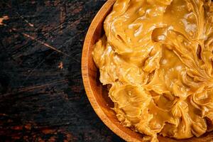 A plate of peanut butter on the table. photo