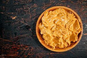 A plate of peanut butter on the table. photo