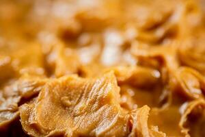 Fresh peanut butter. Macro background. photo