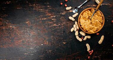 Peanut butter on a plate with a spoon. photo