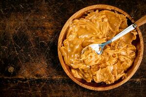 A plate of peanut butter on the table. photo