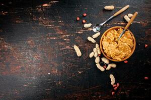 Peanut butter on a plate with a spoon. photo