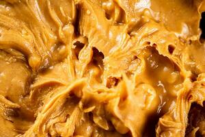 Fresh peanut butter. Macro background. photo