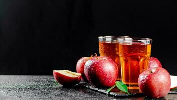 Apple juice on a stone board. photo