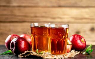 Freshly squeezed apple juice in a glass. photo