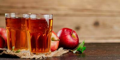 Freshly squeezed apple juice in a glass. photo