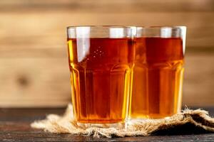 Freshly squeezed apple juice in a glass. photo