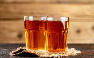 Freshly squeezed apple juice in a glass. photo