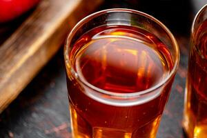 A glass of juice from fresh apples. photo