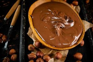 A plate of hazelnut butter on a cutting board. photo