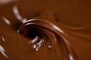 Hazelnut butter curl. Macro background. photo