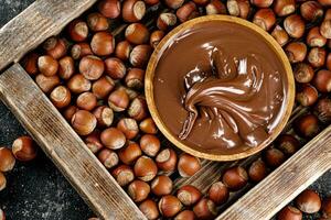 Hazelnut butter on a wooden tray. photo