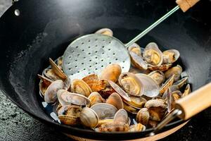 Vongole in a pot of water. photo