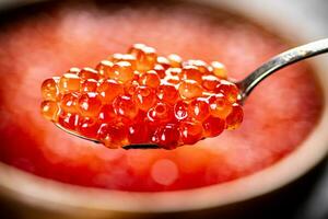 Red caviar in a spoon. photo