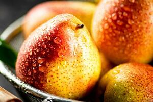 Juicy pears with drops of water. photo