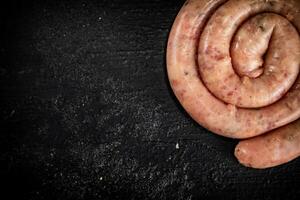 Fresh raw sausages for frying. photo