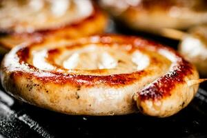 Grilled sausages in a frying pan. photo