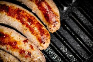 Grilled sausages in a frying pan. photo