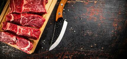 Beef raw cut on a cutting board. photo