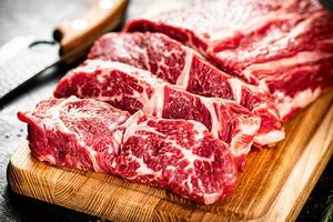 Beef raw cut on a cutting board. photo