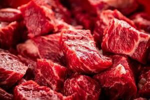 Pieces of raw beef. Macro background. photo