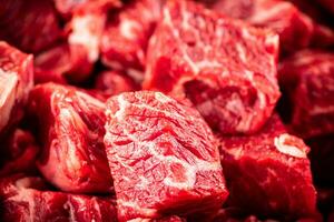 Pieces of raw beef. Macro background. photo