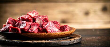 Chopped raw beef on a plate. photo