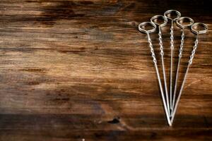 Skewers for kebab on the table. photo