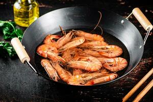 The shrimp are boiled in a pot of water. photo