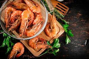Fragrant boiled shrimp in a colander. photo