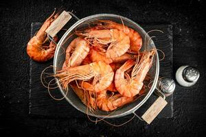 Fragrant boiled shrimp in a colander. photo