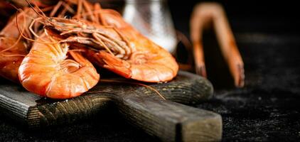 Boiled shrimp on a cutting board. photo