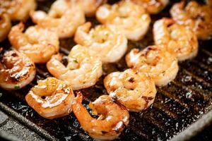 Grilled shrimp in a frying pan. photo