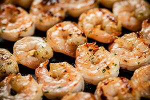 Delicious grilled shrimp. Macro background. photo