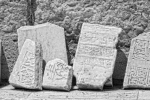 interesting original vintage background with Arabic inscriptions on stone slabs photo