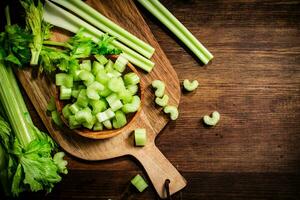 Sliced fresh celery on a cutting board. photo