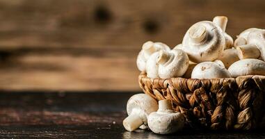 A full basket of mushrooms on the table. photo